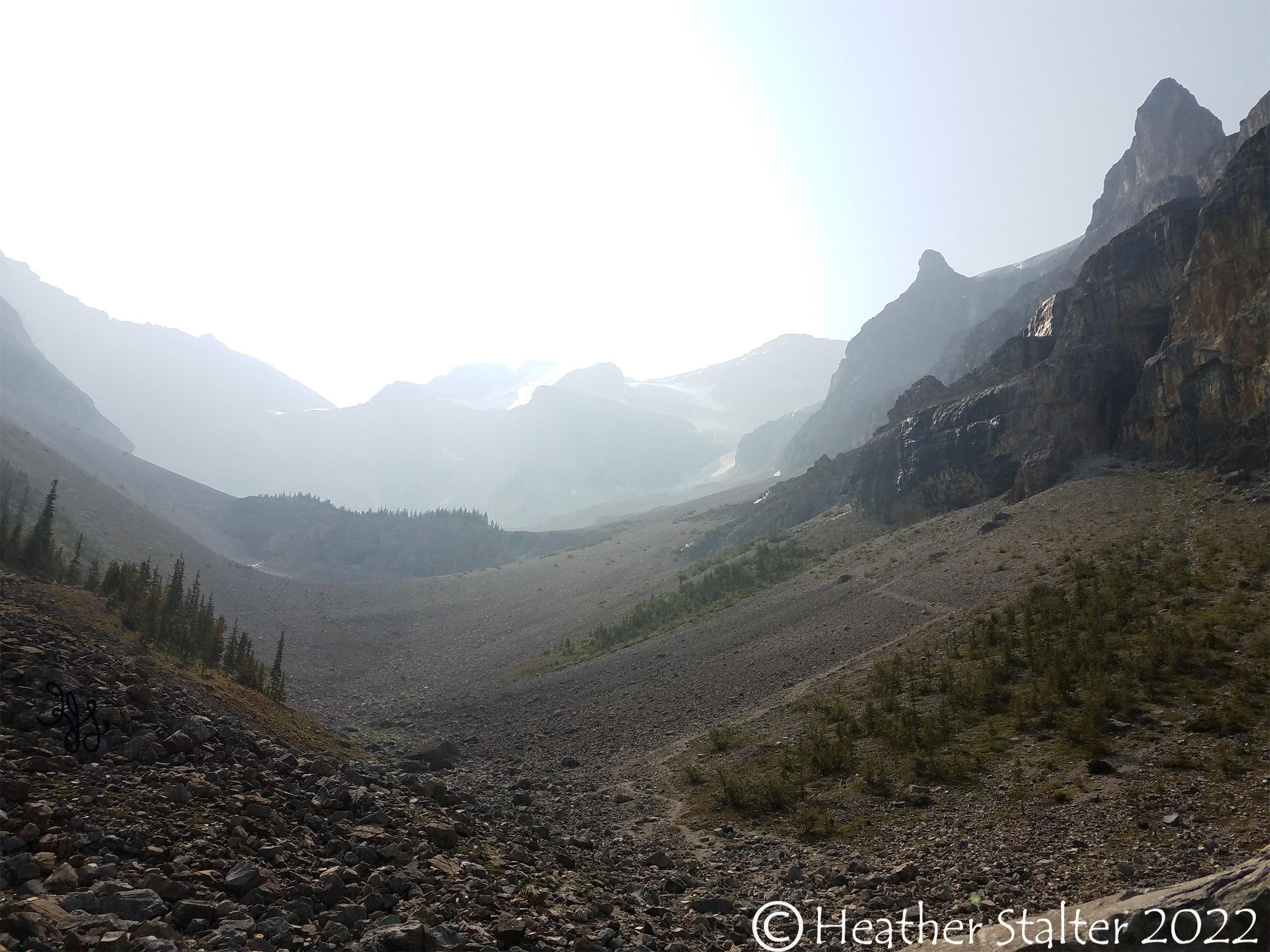 Hazy mountains in distance with a path